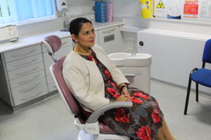 Priti Patel MP tries out a dentist chair