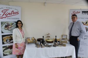 Priti Patel MP with Daren McGrath MD of Tiptree Patisserie, with the home delivery packages the company diversified into during the lockdown.