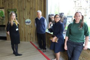 Left to right: Melissa Dench, Business Development Manager, Dominique Tropeano OBE, Zoo Director, Priti Patel MP with curious onlookers over her shoulder and Sarah Forsyth, Zoo Curator
