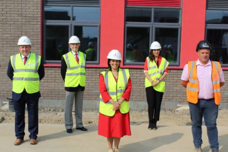Priti Patel (centre) with left to right: Paul Banks, CEO of Chelmsford Learning Partnership, Cllr Ray Gooding, Essex CC Cabinet Member for Education & Learning, Koulla Anslow, Headteacher of Lakelands Primary School and Jason Grimble, Senior Site Manager for Barnes Contruction