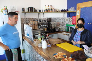 Role reversal. Café Bijou proprietor Paul Long lets Priti Patel take a turn behind the counter.