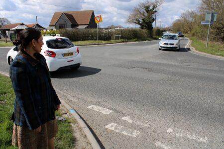 Priti Patel at the junction of Maldon Road and Great Braxted Road, where the road surface is breaking up in large areas.