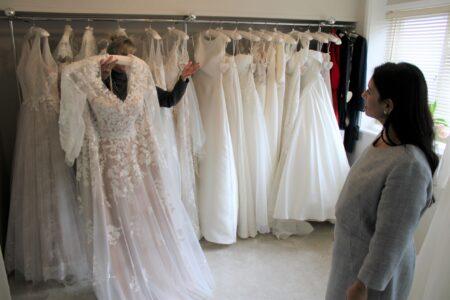 Priti admires wedding dresses at the J’Adore Bridal Boutique.