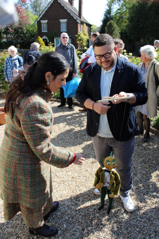 Priti Patel with Joy Laurey biographer and archivist Stuart Woodhead and a replica of Mr Turnip