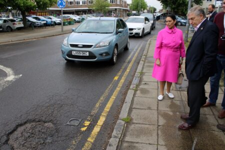 Priti Patel MP and Cllr Lee Scott inspect the decaying road surface in Church Road.