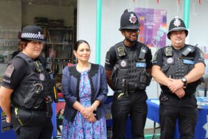 Priti Patel MP with local police officers at the Grove Centre, Witham.
