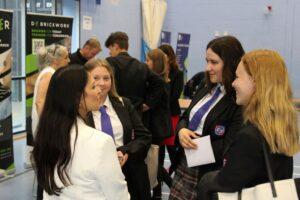 Priti chats to students during her tour of the Careers Fair exhibition.