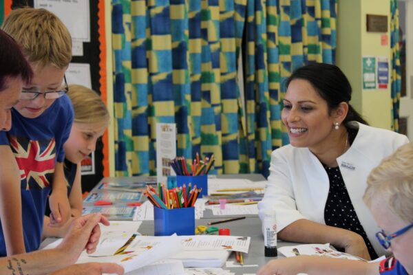 Priti with pupils at Tiptree Heath Primary School on Get Witham Reading day.